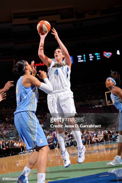 Janel McCarville of the New York Liberty goes up for a shot against Candice Dupree of the Chicago Sky on August 14, 2009 at Madison Square Garden in...