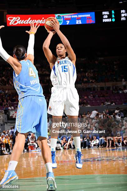 Kia Vaughn of the New York Liberty shoots against Candice Dupree of the Chicago Sky on August 14, 2009 at Madison Square Garden in New York City....