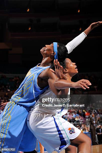 Kia Vaughn of the New York Liberty plays defense against Sylvia Fowles of the Chicago Sky on August 14, 2009 at Madison Square Garden in New York...