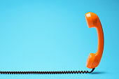 Telephone in retro style on blue background.