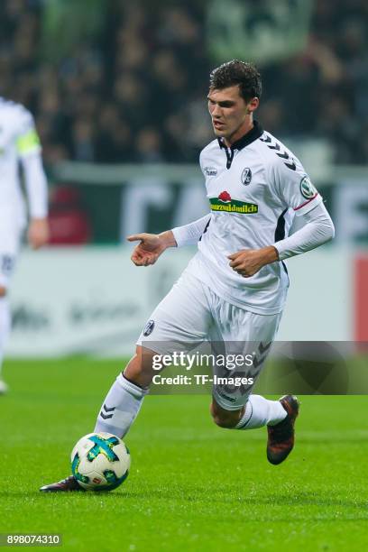 Pascal Stenzel of Freiburg controls the ball during the DFB Cup match between Werder Bremen and SC Freiburg at Weserstadion on December 20, 2017 in...