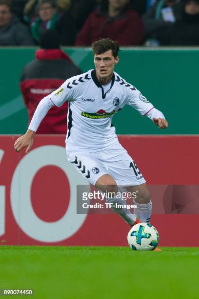 Pascal Stenzel of Freiburg controls the ball during the DFB Cup match between Werder Bremen and SC Freiburg at Weserstadion on December 20, 2017 in...