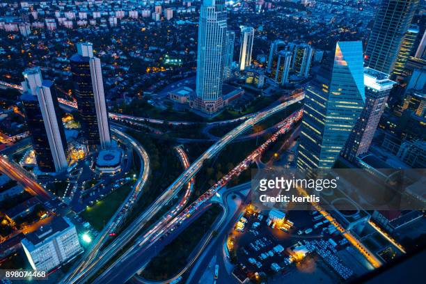 roads and skyscrapers of istanbul at night - istanbul stock pictures, royalty-free photos & images