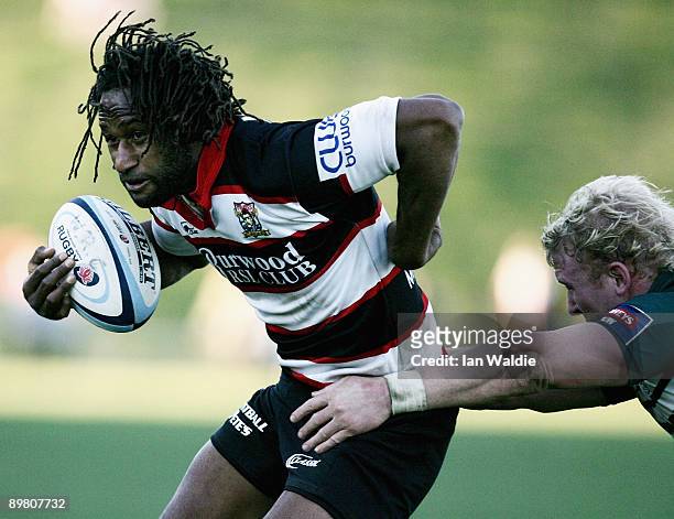 Lote Tuqiri of West Harbour is tacked by Beau Robinson of Warringah during the round 20 Shute Shield match between Warringah and West Harbouron at...