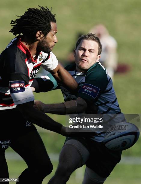 Lote Tuqiri of West Harbour is tackled by Jordan Macey of Warringah during the round 20 Shute Shield match between Warringah and West Harbouron at...