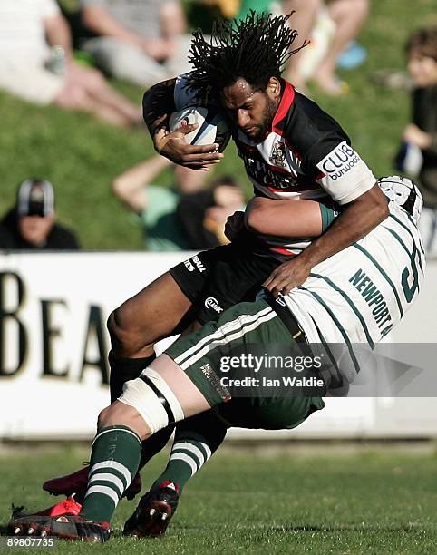 Lote Tuqiri of West Harbour is tackled by Chris Thomson of Warringah during the round 20 Shute Shield match between Warringah and West Harbouron at...