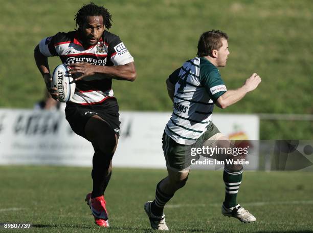 Lote Tuqiri of West Harbour runs past Jordan Macey of Warringah during the round 20 Shute Shield match between Warringah and West Harbouron at...
