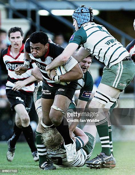 Tom Hikila of West Harbour is tackled during the round 20 Shute Shield match between Warringah and West Harbouron at Pittwater Rugby Park on August...