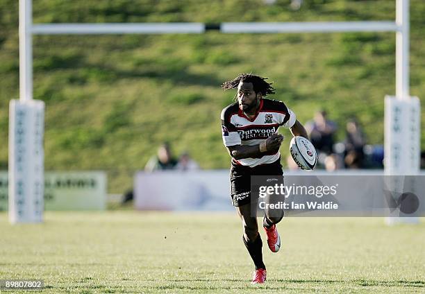 Lote Tuqiri of West Harbour runs the ball during the round 20 Shute Shield match between Warringah and West Harbouron at Pittwater Rugby Park on...