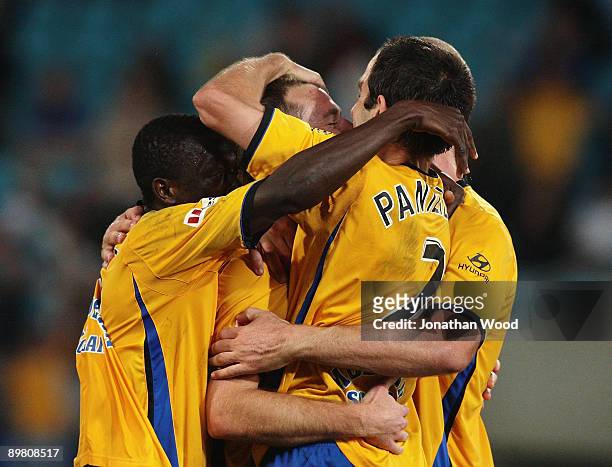 Shane Smeltz of United celebrates with team mates after scoring a goal during the round two A-League match between Gold Coast United and North...