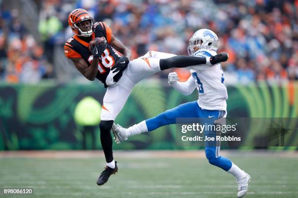 Green of the Cincinnati Bengals makes a catch defended by Darius Slay of the Detroit Lions during the first half at Paul Brown Stadium on December...