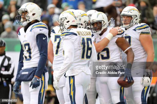 Antonio Gates of the Los Angeles Chargers is congratulated by his teammates after scoring a first half touchdown reception against the New York Jets...