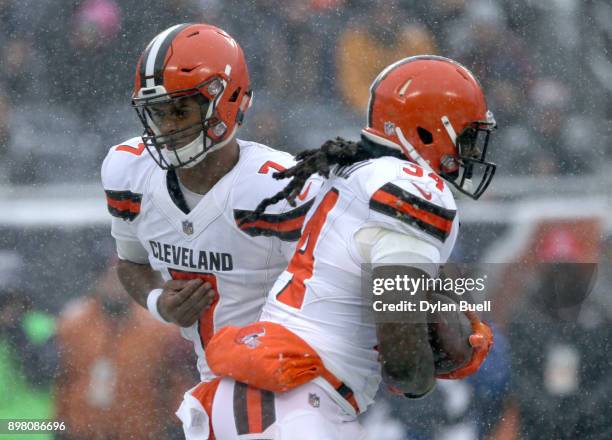 Quarterback DeShone Kizer of the Cleveland Browns hands the football off to Isaiah Crowell in the first quarter against the Chicago Bears at Soldier...