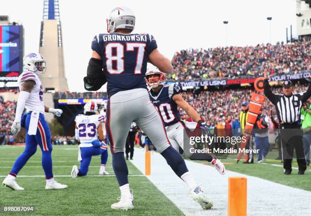 Rob Gronkowski of the New England Patriots reacts with Danny Amendola after catching a touchdown pass during the second quarter of a game against the...