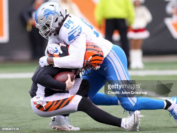Ezekiel Ansah of the Detroit Lions sacks Andy Dalton of the Cincinnati Bengals during the first half at Paul Brown Stadium on December 24, 2017 in...