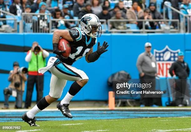 Damiere Byrd of the Carolina Panthers returns a kick against the Tampa Bay Buccaneers in the first quarter at Bank of America Stadium on December 24,...