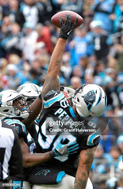 Julius Peppers of the Carolina Panthers reacts after a play against the Tampa Bay Buccaneers in the second quarter at Bank of America Stadium on...