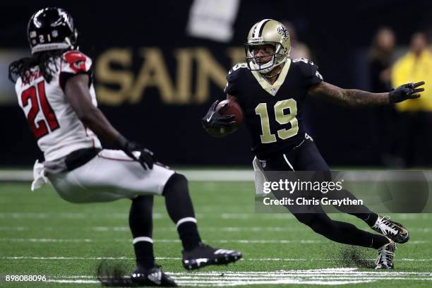 Ted Ginn of the New Orleans Saints runs with the ball as Desmond Trufant of the Atlanta Falcons defends during the first half of a game at the...