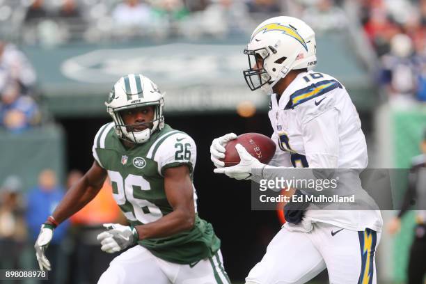 Tyrell Williams of the Los Angeles Chargers is pursued by Marcus Maye of the New York Jets during the first half of an NFL game at MetLife Stadium on...