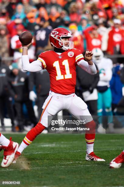 Quarterback Alex Smith of the Kansas City Chiefs throws a pass during the first quarter of the game against the Miami Dolphins at Arrowhead Stadium...