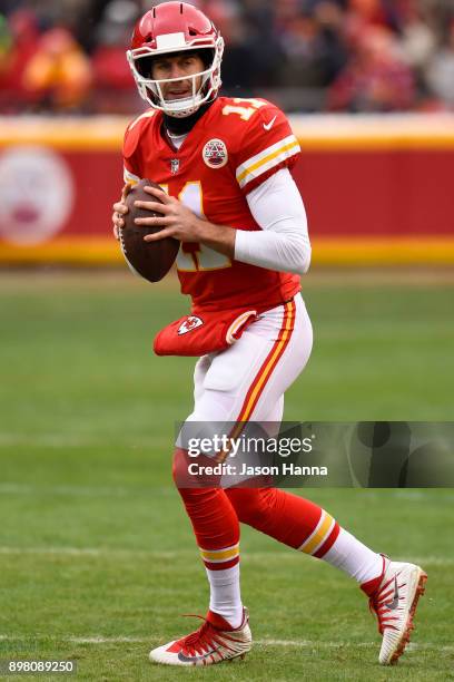 Quarterback Alex Smith of the Kansas City Chiefs throws on the sidelines waiting to take the field prior to the game against the the Miami Dolphins...