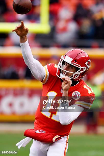 Quarterback Alex Smith of the Kansas City Chiefs throws on the sidelines waiting to take the field prior to the game against the the Miami Dolphins...