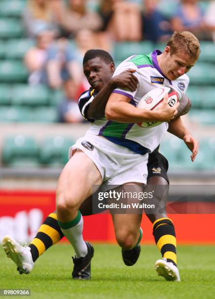 Joe Ford of Leeds Carnegie is tackled by Christian Wacle of London Wasps during the Middlesex Sevens at Twickenham Stadium on August 15, 2009 in...