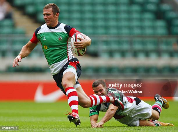 Karl Dickson of Harlequins tries to tackle Ifan Evans of Kukri White Hart Marauders during the Middlesex Sevens at Twickenham Stadium on August 15,...