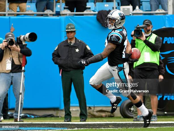 Damiere Byrd of the Carolina Panthers returns a kick for a touchdown against the Tampa Bay Buccaneers in the second quarter at Bank of America...