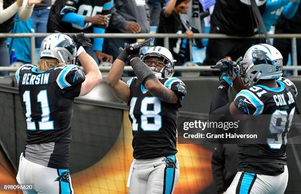 Damiere Byrd celebrates with teammates Brenton Bersin and Bryan Cox Jr of the Carolina Panthers after a kick return for a touchdown against the Tampa...
