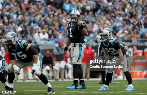 Cam Newton gets set in the backfield with teammate Christian McCaffrey of the Carolina Panthers against the Tampa Bay Buccaneers in the first quarter...