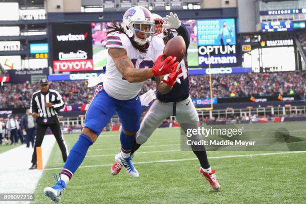 Kelvin Benjamin of the Buffalo Bills catches a touchdown pass as he is defended by Stephon Gilmore of the New England Patriots during the quarter of...