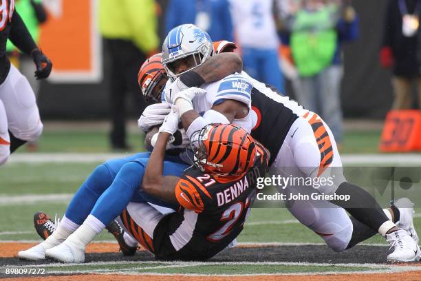 Theo Riddick of the Detroit Lions is tackled by Darqueze Dennard of the Cincinnati Bengals during the first half at Paul Brown Stadium on December...