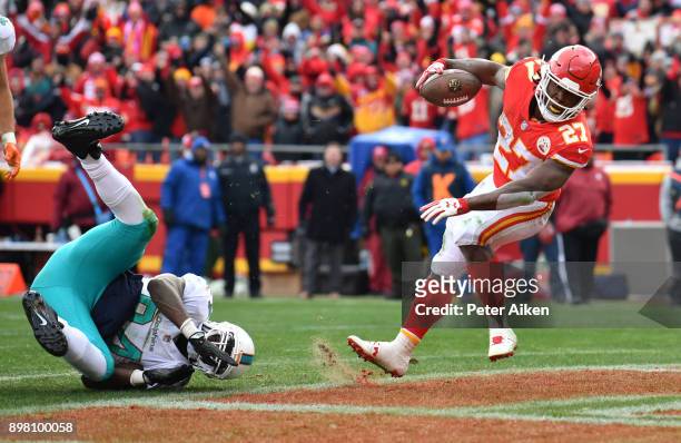 Running back Kareem Hunt of the Kansas City Chiefs crosses the goal line on a one yard touchdown run over outside linebacker Lawrence Timmons of the...