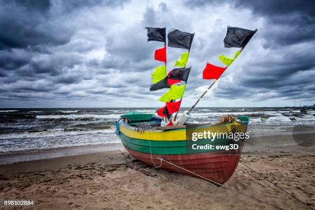 fisherman boat on the beach in sopot, poland - skipjack stock pictures, royalty-free photos & images