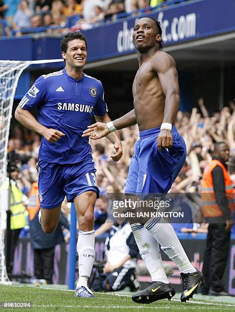 Chelsea's Ivorian striker Didier Drogba celebrates scoring his second goal with Chelsea's German player Michael Ballack during the Premier League...
