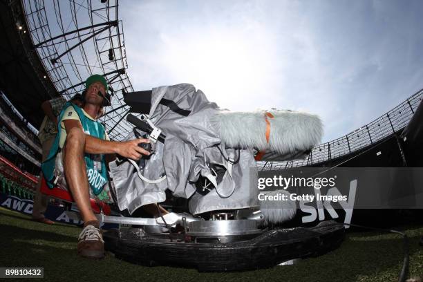 Cameraman of pay-TV station Sky sits next to the pitch during the Bundesliga match between Hannover 96 and Mainz 05 at the ADW-Arena on August 15,...