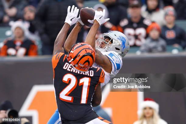 Marvin Jones of the Detroit Lions makes a catch defended by Darqueze Dennard of the Cincinnati Bengals during the second half at Paul Brown Stadium...