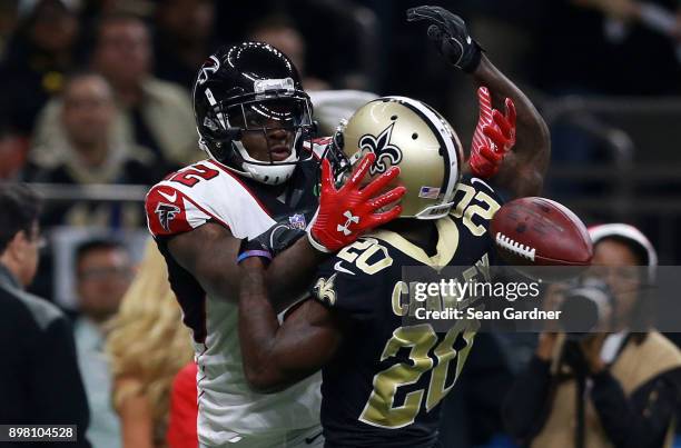 Mohamed Sanu of the Atlanta Falcons tries to catch the ball as Ken Crawley of the New Orleans Saints defends during the second half of a game at the...