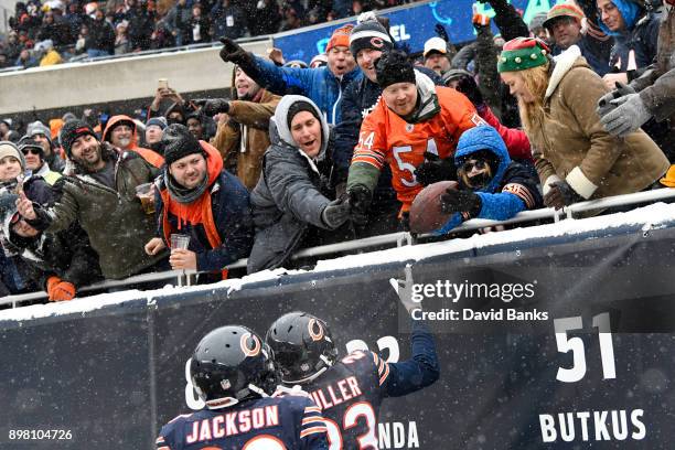 Kyle Fuller of the Chicago Bears gives a fan the football after making an interception against the Cleveland Browns in the second quarter at Soldier...