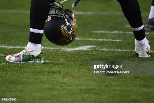 Wrapped presents are seen on the shoes of Malik Jackson of the Jacksonville Jaguars prior to their NFL game against the San Francisco 49ers at Levi's...