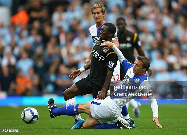 Shaun Wright- Phillips of Manchester City is tackled by Stephen Warnock of Blackburn Rovers during the Barclays Premier League match between...