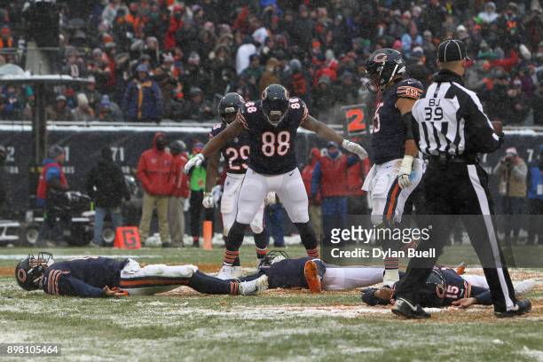 Quarterback Mitchell Trubisky of the Chicago Bears makes a snow angel with teammates after scoring against the Cleveland Browns in the third quarter...