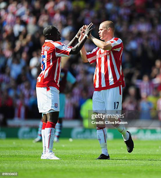 Ryan Shawcross of Stoke City is congratulated on his goal by captain Abdoulaye Faye of Stoke City during the Barclays Premiership match Between Stoke...