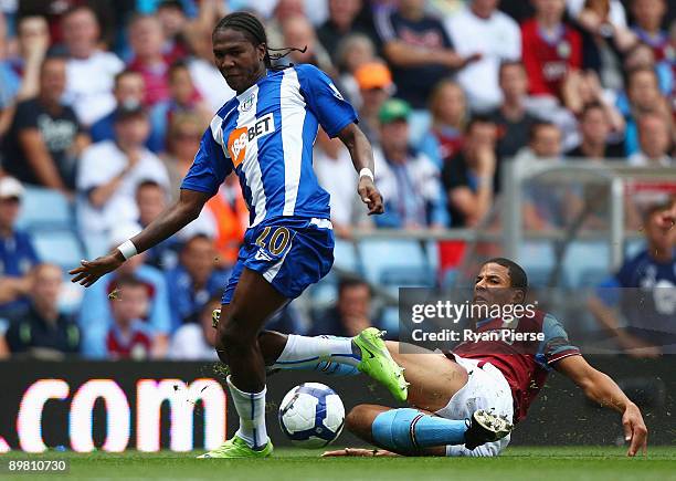 Hugo Rodallega of Wigan is tackled by Curtis Davies of Aston Villa during the Barclays Premier League match between Aston Villa and Wigan Athletic at...