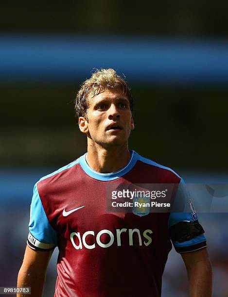 Stiliyan Petrov of Aston Villa wears a black armband to honor the brother of teammate Luke Young who was found dead in Crete last week during the...