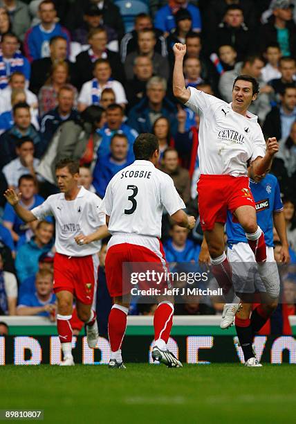 Carl Finnigan of Falkirk celebrates after scoring during the Scottish Premier League match between Rangers and Falkirk at Ibrox Stadium on August 15,...