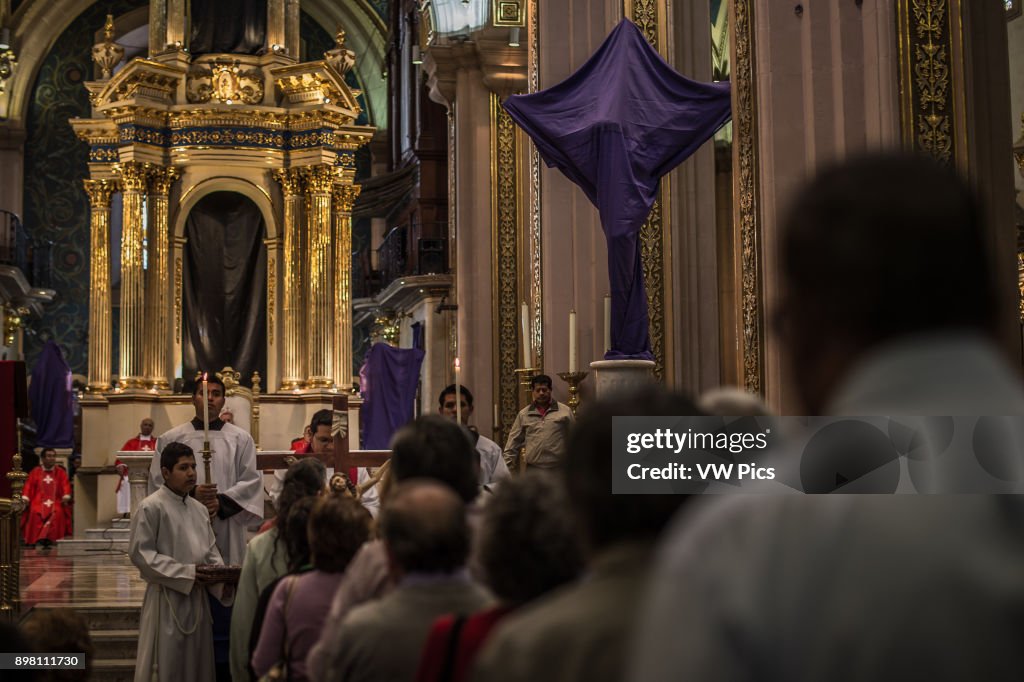 In the churches, the images of saints are covered on purple cloths as a sign of mourning, bread is distributed to remember the Last Supper and sprigs of chamomile are blessed