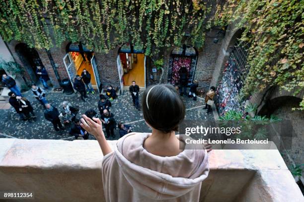 An actress representing Juliet stands on 'Juliet's Balcony' in Via Cappello 23, which is today known as “Juliet’s House” on November 20, 2017 in...