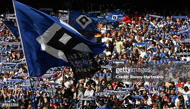 Supporters of Hamburg cheer their team during the Bundesliga match between Hamburger SV and Borussia Dortmund at the HSH Nordbank Arena on August 15,...